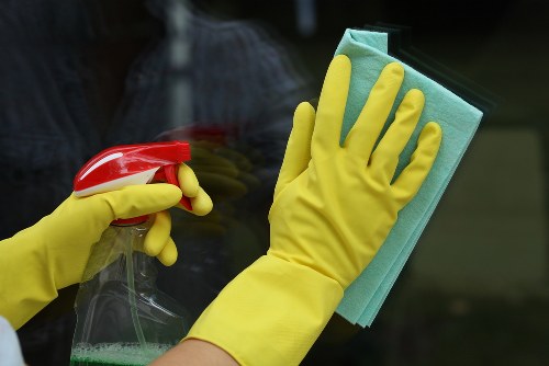 Cleaner working in a Bermondsey apartment living room