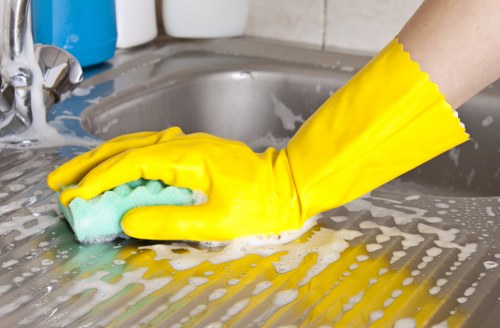 Staff member receiving oven cleaning safety training in Bermondsey